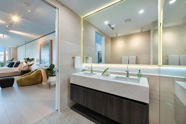 a bathroom with a double vanity sink and a mirror