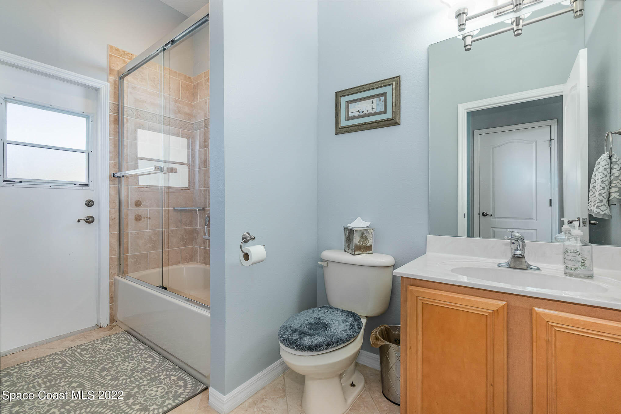 1836 Windbrook Drive Palm Bay, FL 32909 - Photo 32 of 41 a bathroom with a granite countertop toilet a sink and a bathtub