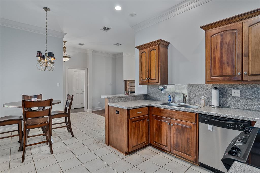 102 Fitzwilliam Street Haughton, LA 71037 - Photo 8 of 18 a kitchen with a sink cabinets and dining table chair