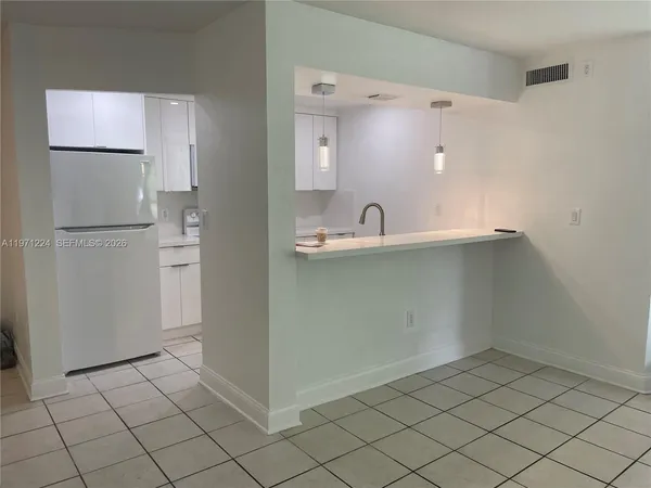 $244,000 | 7165 Northwest 186th Street, Unit A104, Hialeah, FL 33015