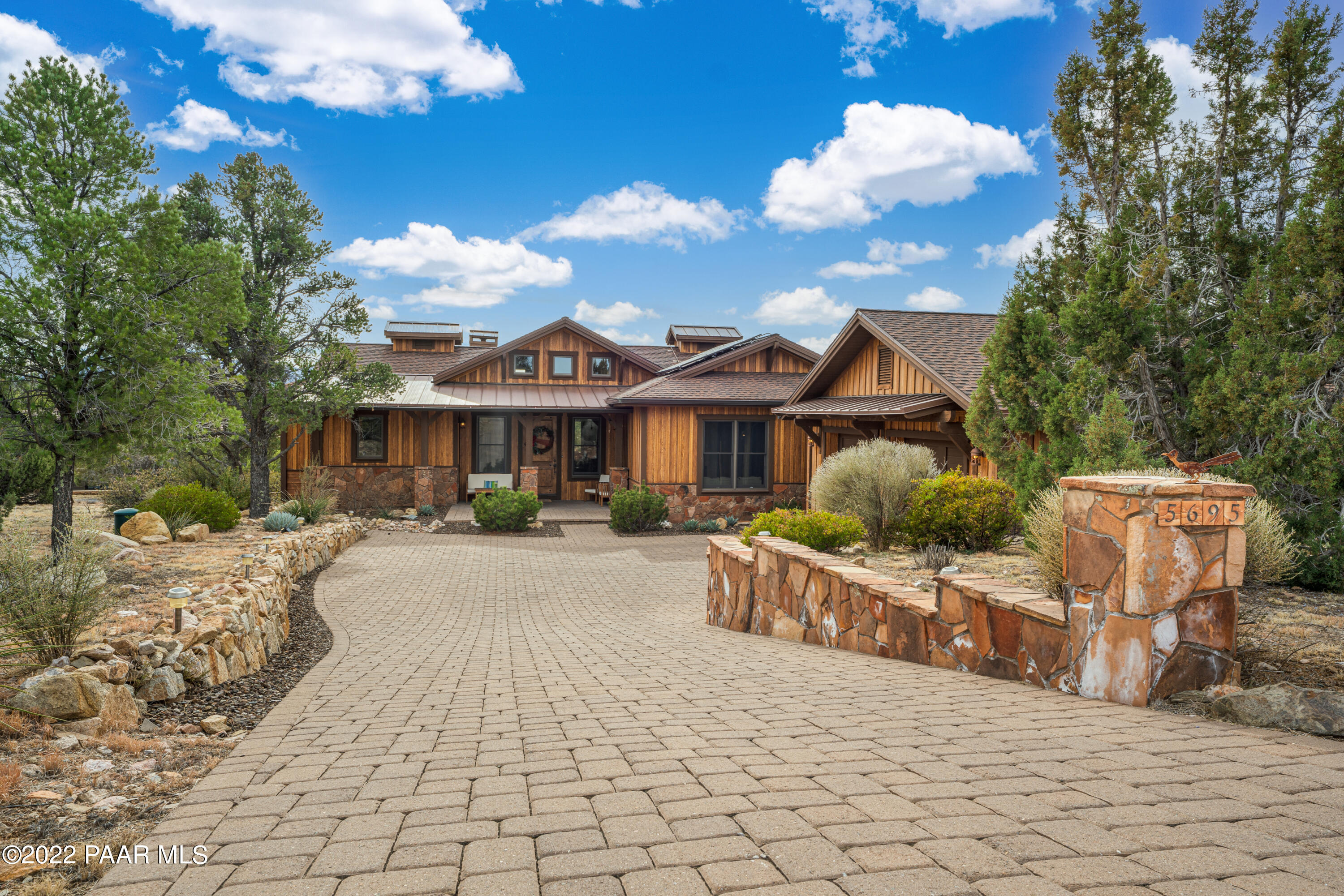 5695 West Three Forks Road Prescott, AZ 86305 - Photo 1 of 48 a front view of a house with a yard