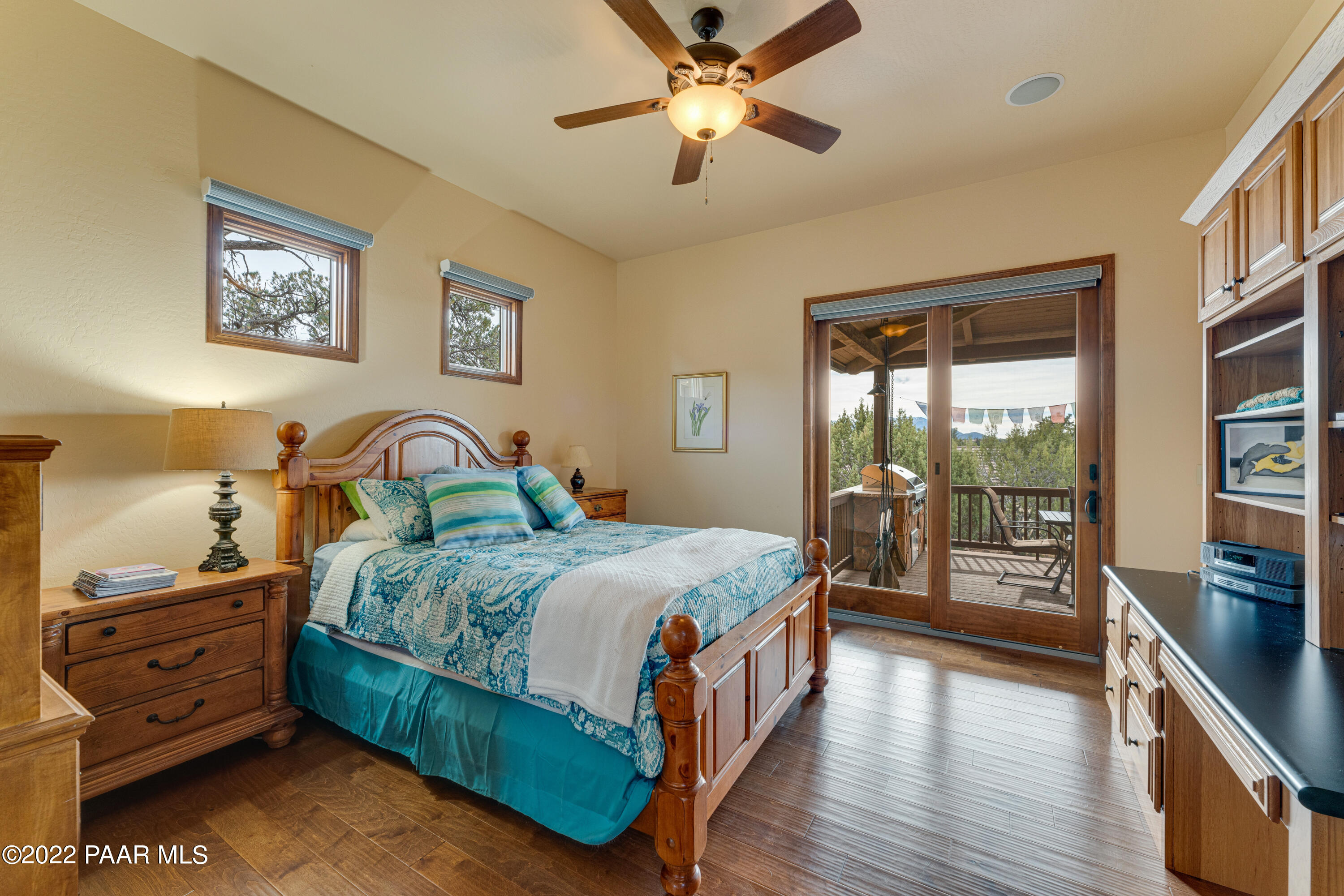 5695 West Three Forks Road Prescott, AZ 86305 - Photo 25 of 48 a bedroom with a bed and a flat tv screen on the dresser