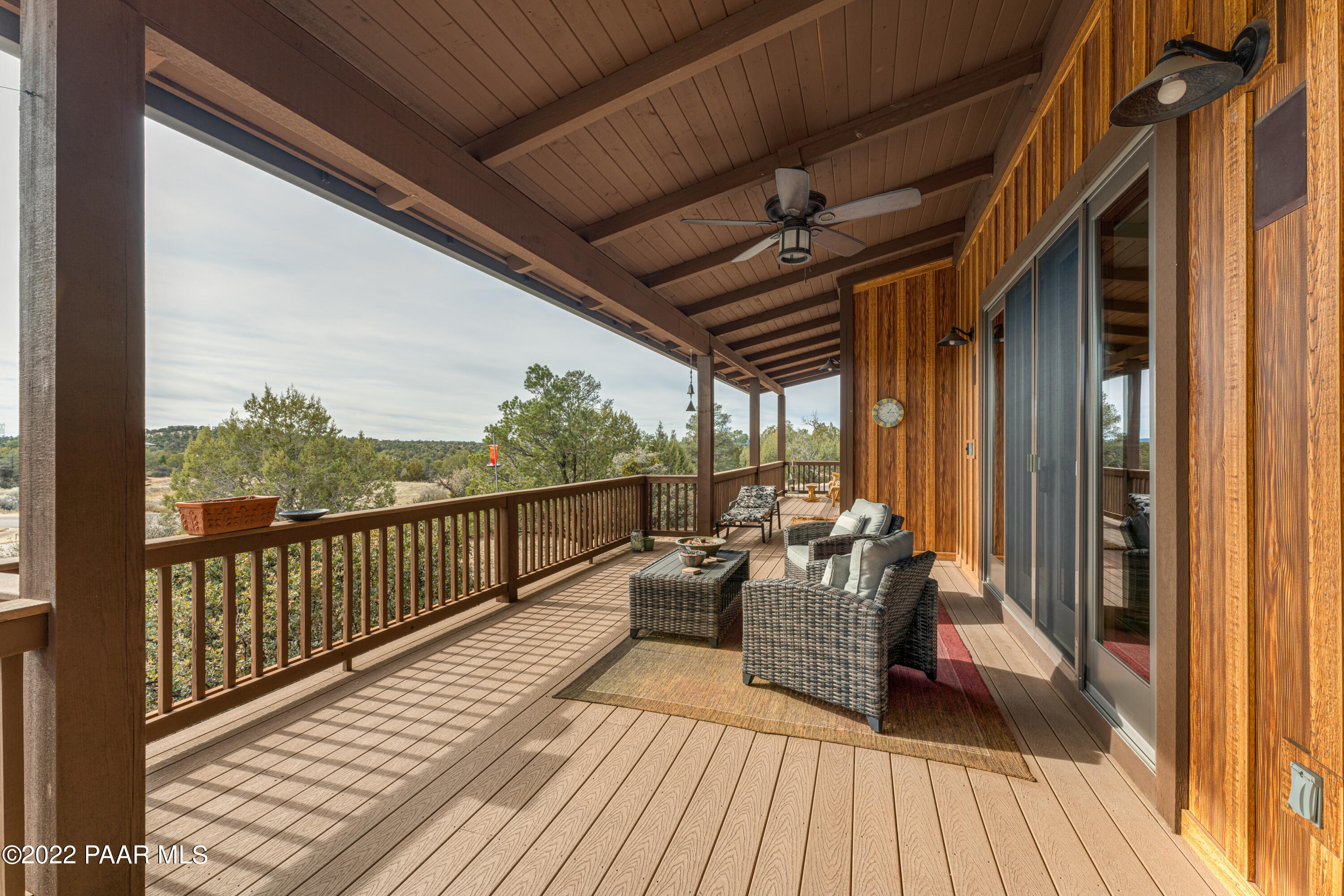 5695 West Three Forks Road Prescott, AZ 86305 - Photo 29 of 48 a view of balcony with couch and wooden floor