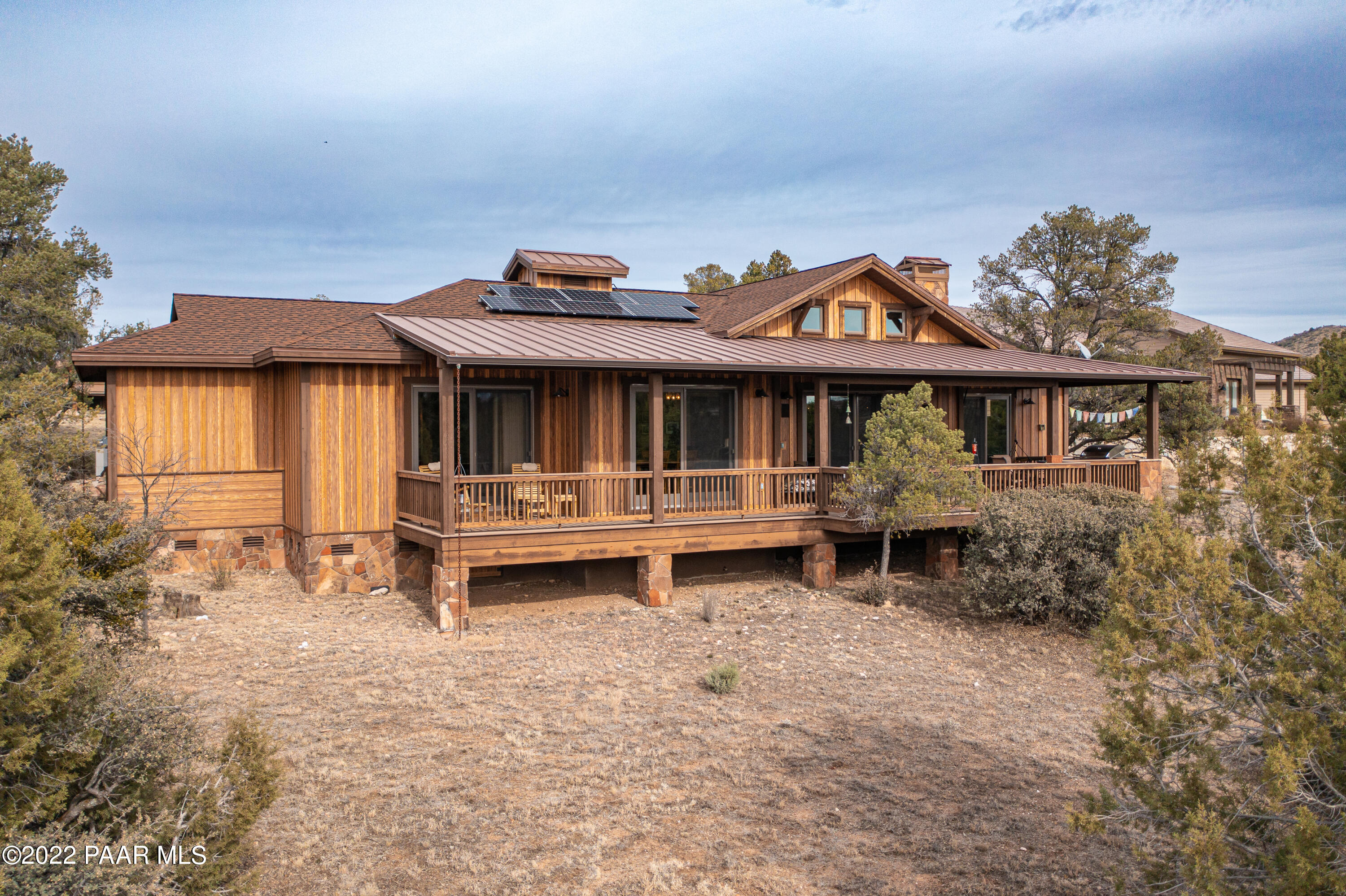 5695 West Three Forks Road Prescott, AZ 86305 - Photo 33 of 48 a front view of a house with a yard and balcony