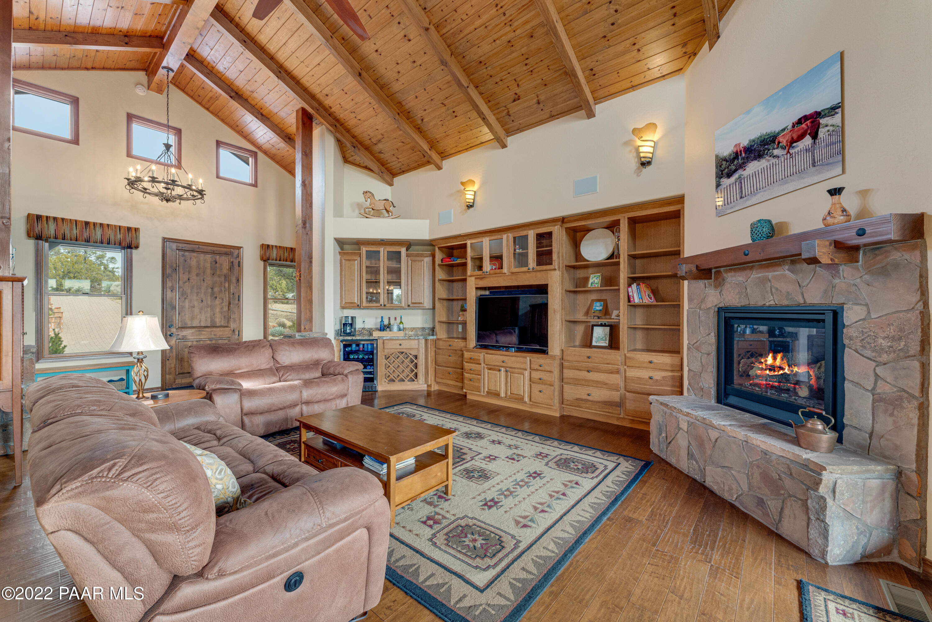 5695 West Three Forks Road Prescott, AZ 86305 - Photo 9 of 48 a living room with furniture and a fireplace