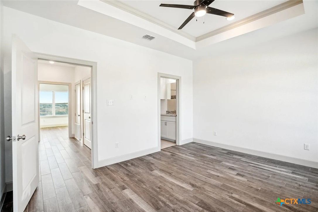 289 Star Grass, Unit 3 Spring Branch, TX 78070 - Photo 19 of 40 wooden floor in an empty room