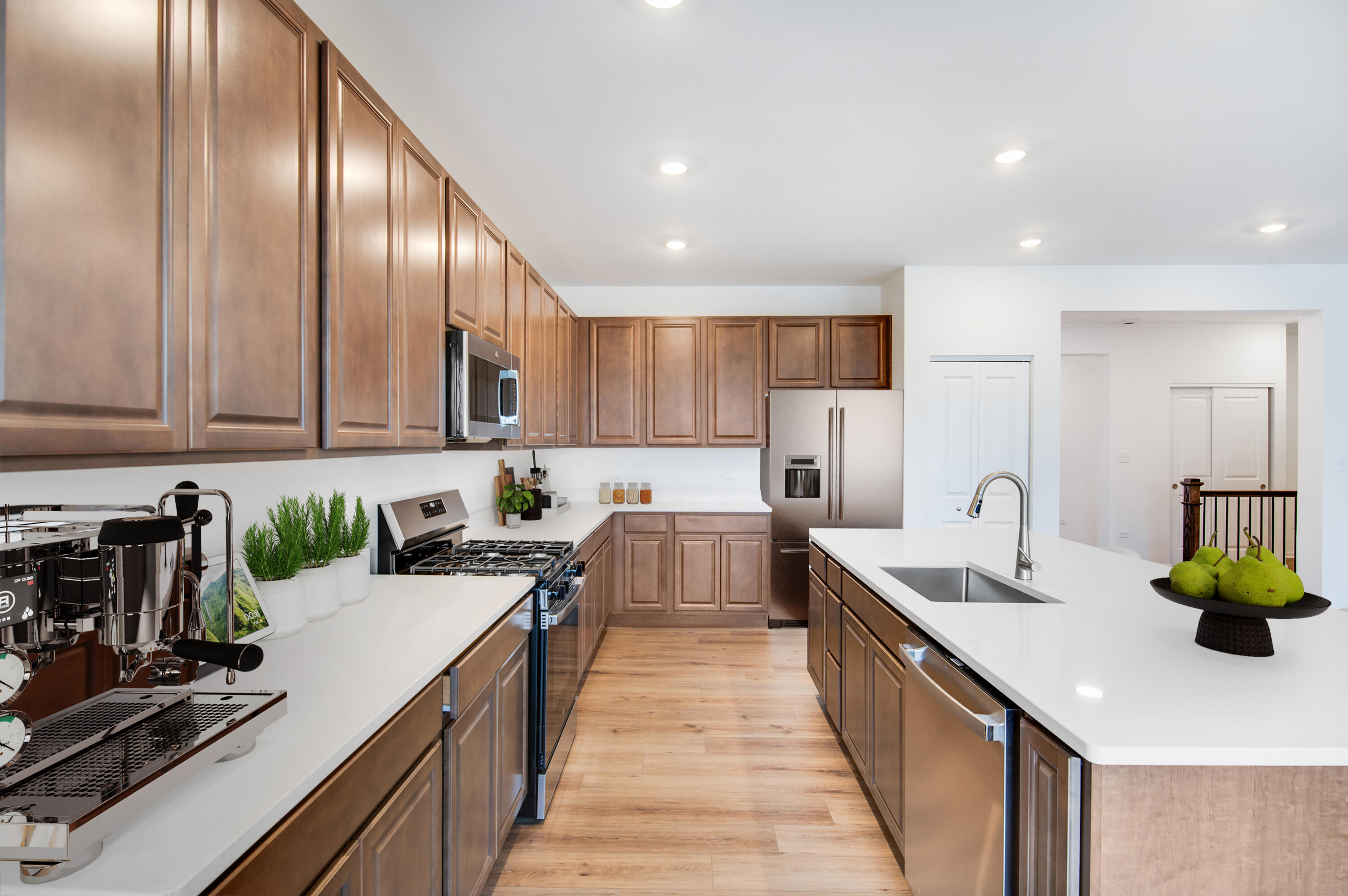 6054 East 112th Place Winfield, IN 46307 - Photo 13 of 29 a kitchen with a sink stainless steel appliances cabinets and a counter top space