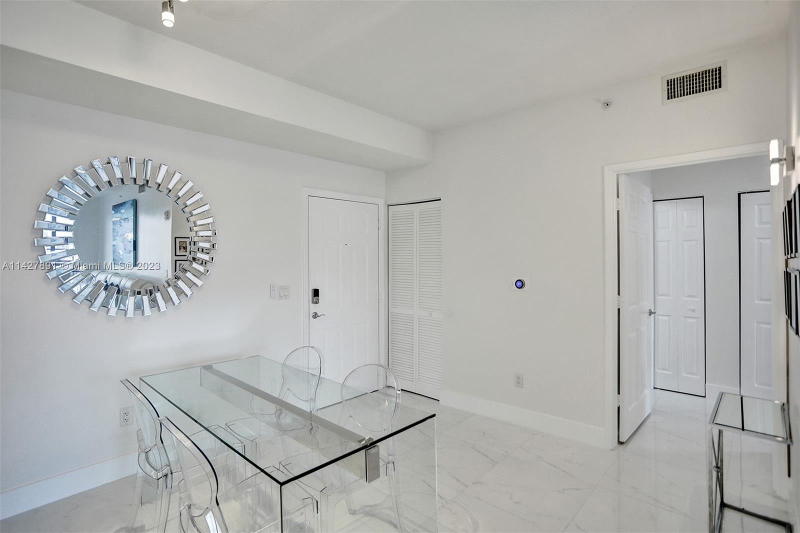 233 South Federal Highway, Unit 605 Boca Raton, FL 33432 - Photo 12 of 41 a view of an entryway with table and mirror