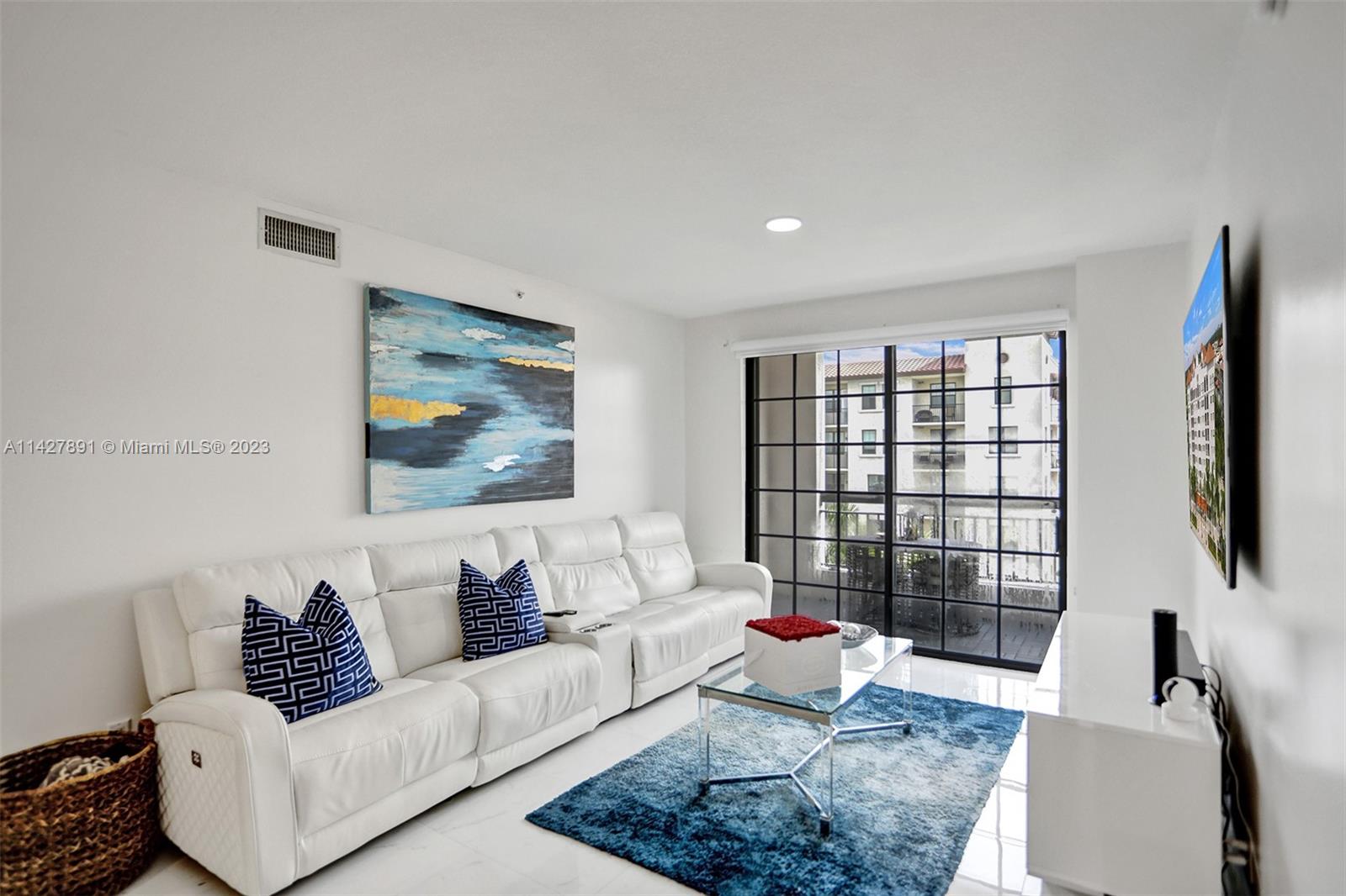 233 South Federal Highway, Unit 605 Boca Raton, FL 33432 - Photo 15 of 41 a living room with furniture and a flat screen tv