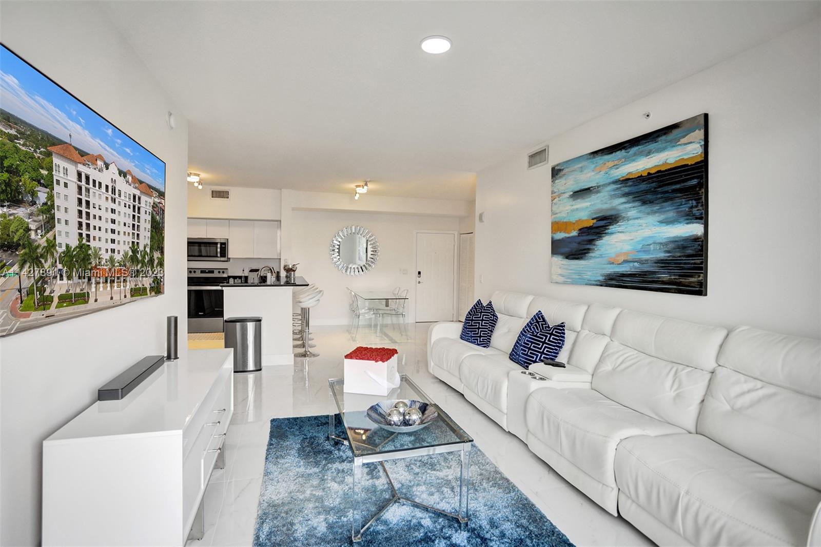 233 South Federal Highway, Unit 605 Boca Raton, FL 33432 - Photo 16 of 41 a living room with furniture and a flat screen tv