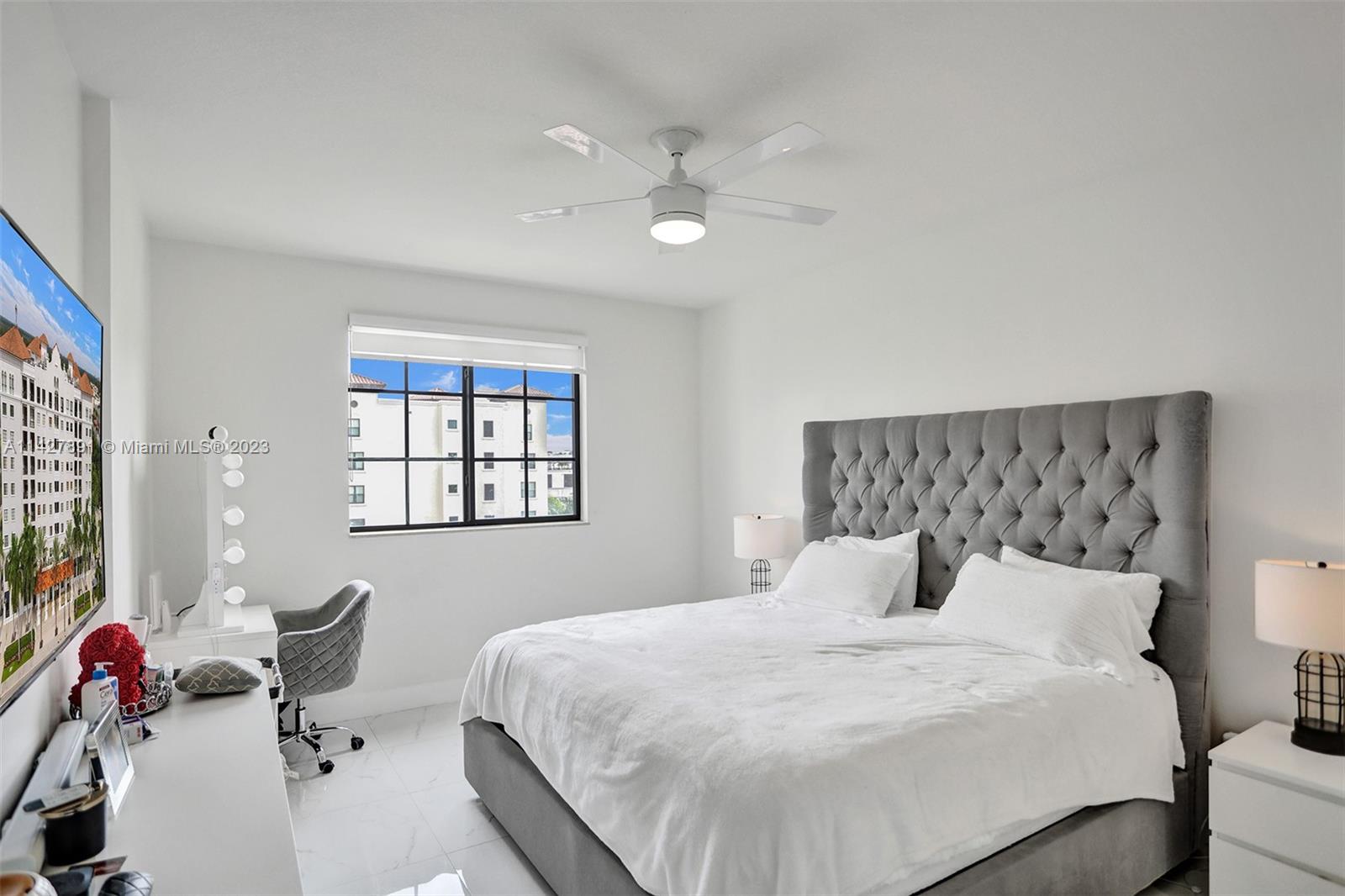 233 South Federal Highway, Unit 605 Boca Raton, FL 33432 - Photo 17 of 41 a bedroom with a bed and a couch