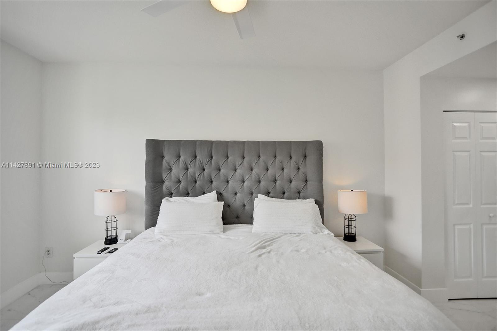 233 South Federal Highway, Unit 605 Boca Raton, FL 33432 - Photo 19 of 41 a bedroom with a bed and window