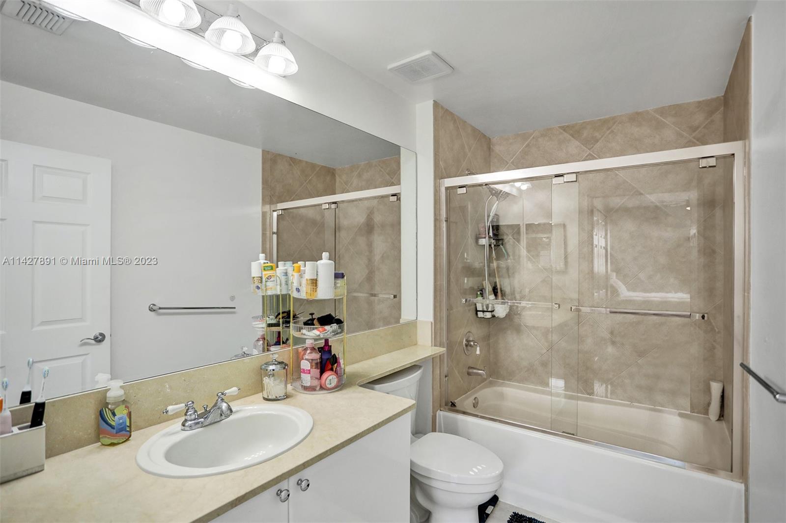 233 South Federal Highway, Unit 605 Boca Raton, FL 33432 - Photo 21 of 41 a bathroom with a sink a toilet and shower