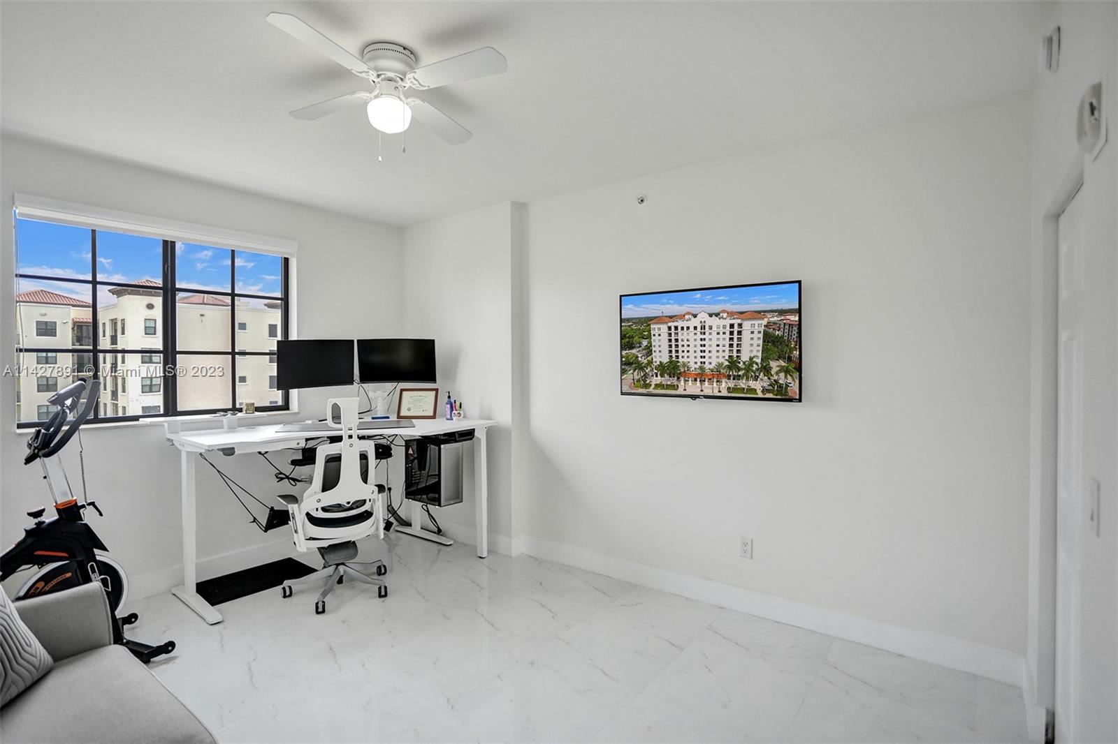 233 South Federal Highway, Unit 605 Boca Raton, FL 33432 - Photo 23 of 41 a view of a workspace with furniture and a window