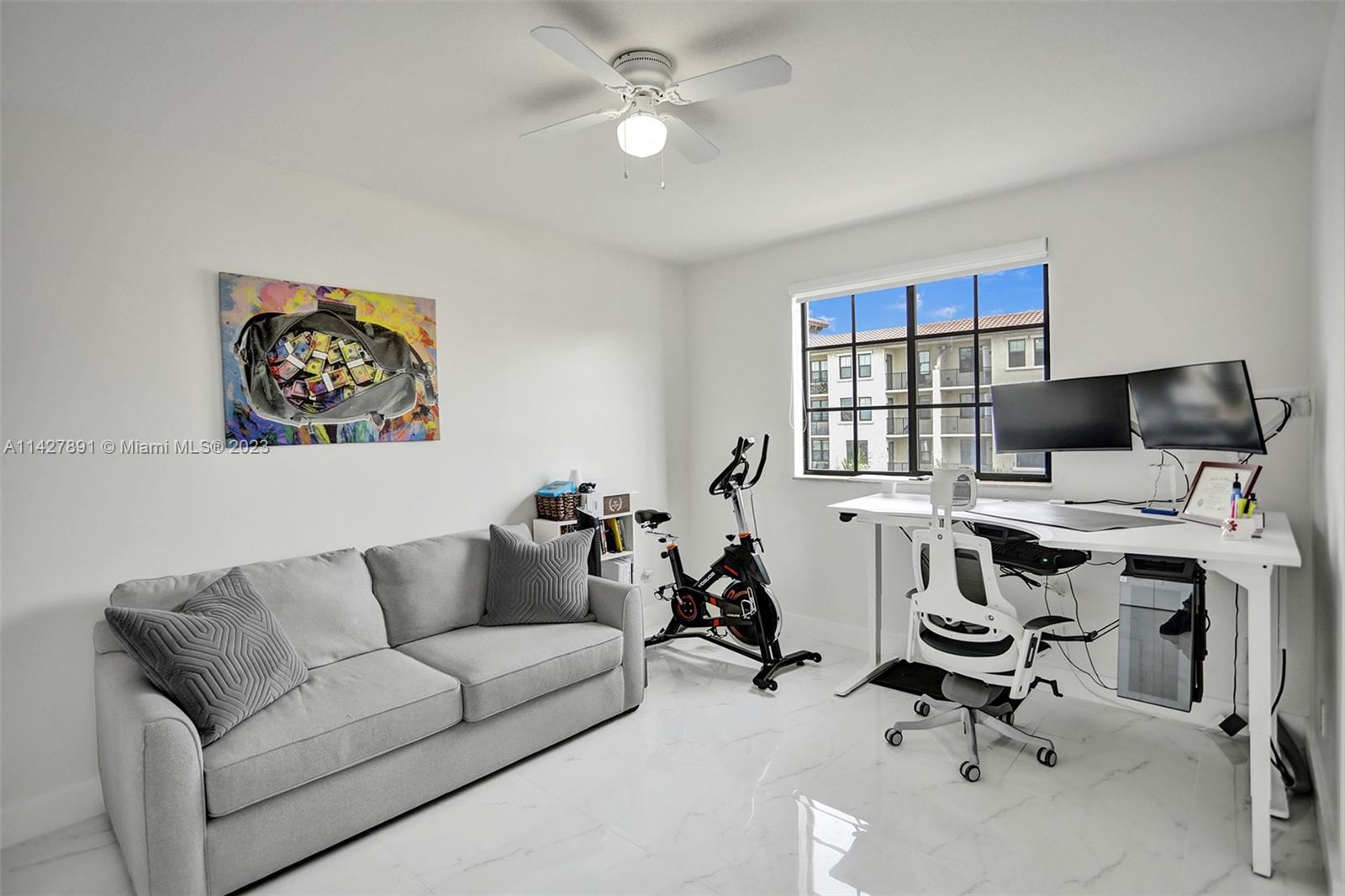 233 South Federal Highway, Unit 605 Boca Raton, FL 33432 - Photo 25 of 41 a view of a livingroom with workspace and a couch