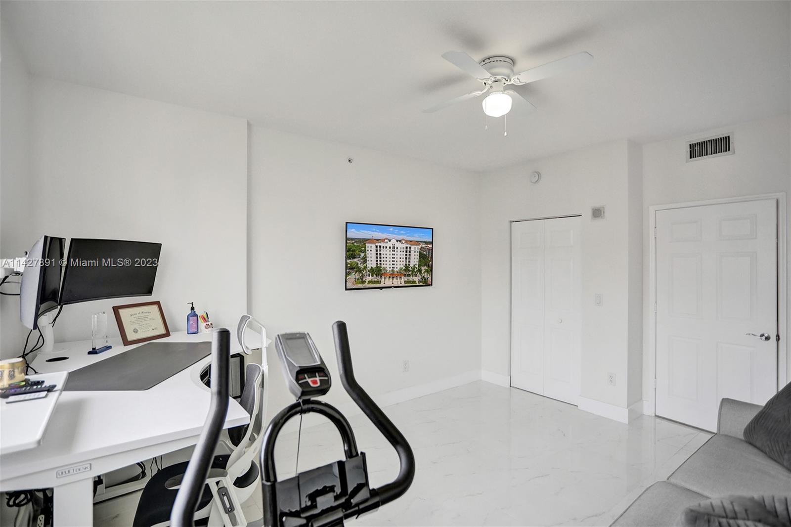 233 South Federal Highway, Unit 605 Boca Raton, FL 33432 - Photo 26 of 41 a workspace with furniture and white walls