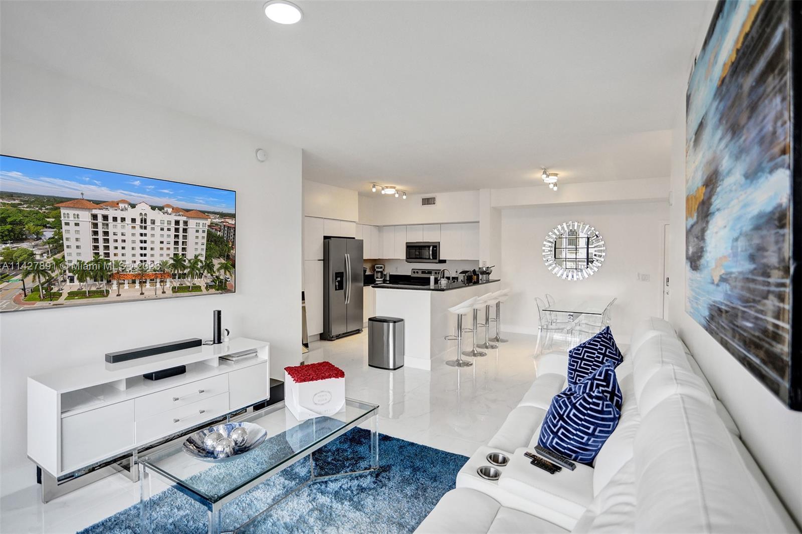 233 South Federal Highway, Unit 605 Boca Raton, FL 33432 - Photo 3 of 41 a living room with furniture and a window