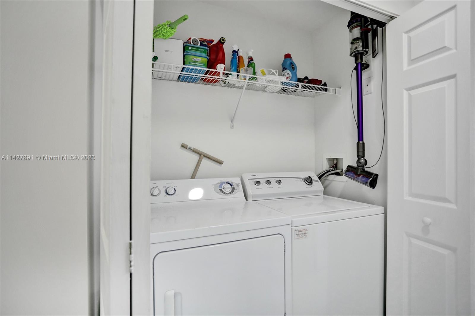 233 South Federal Highway, Unit 605 Boca Raton, FL 33432 - Photo 31 of 41 a utility room with dryer and washer