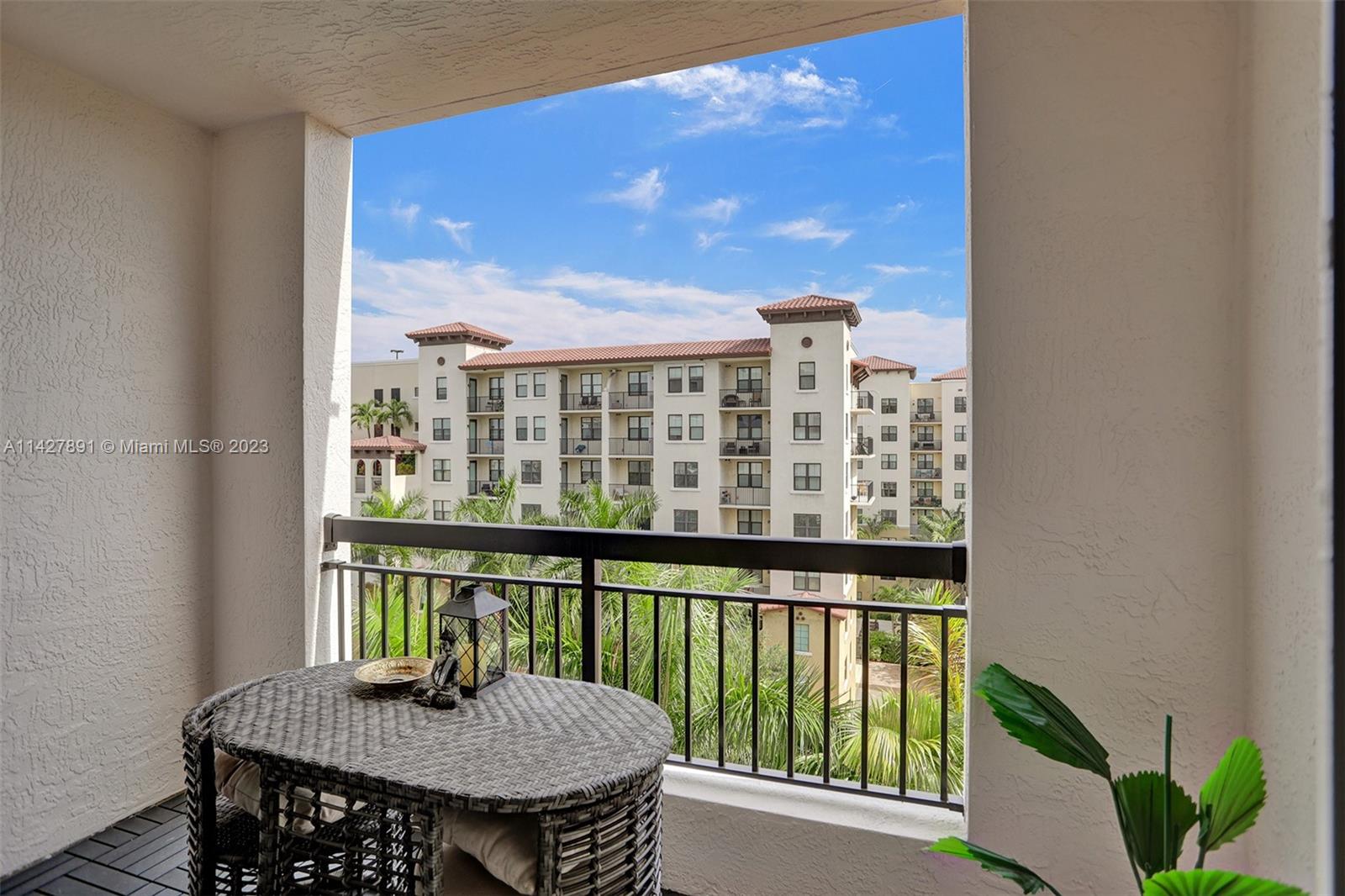 233 South Federal Highway, Unit 605 Boca Raton, FL 33432 - Photo 32 of 41 a view of a balcony with table and chairs