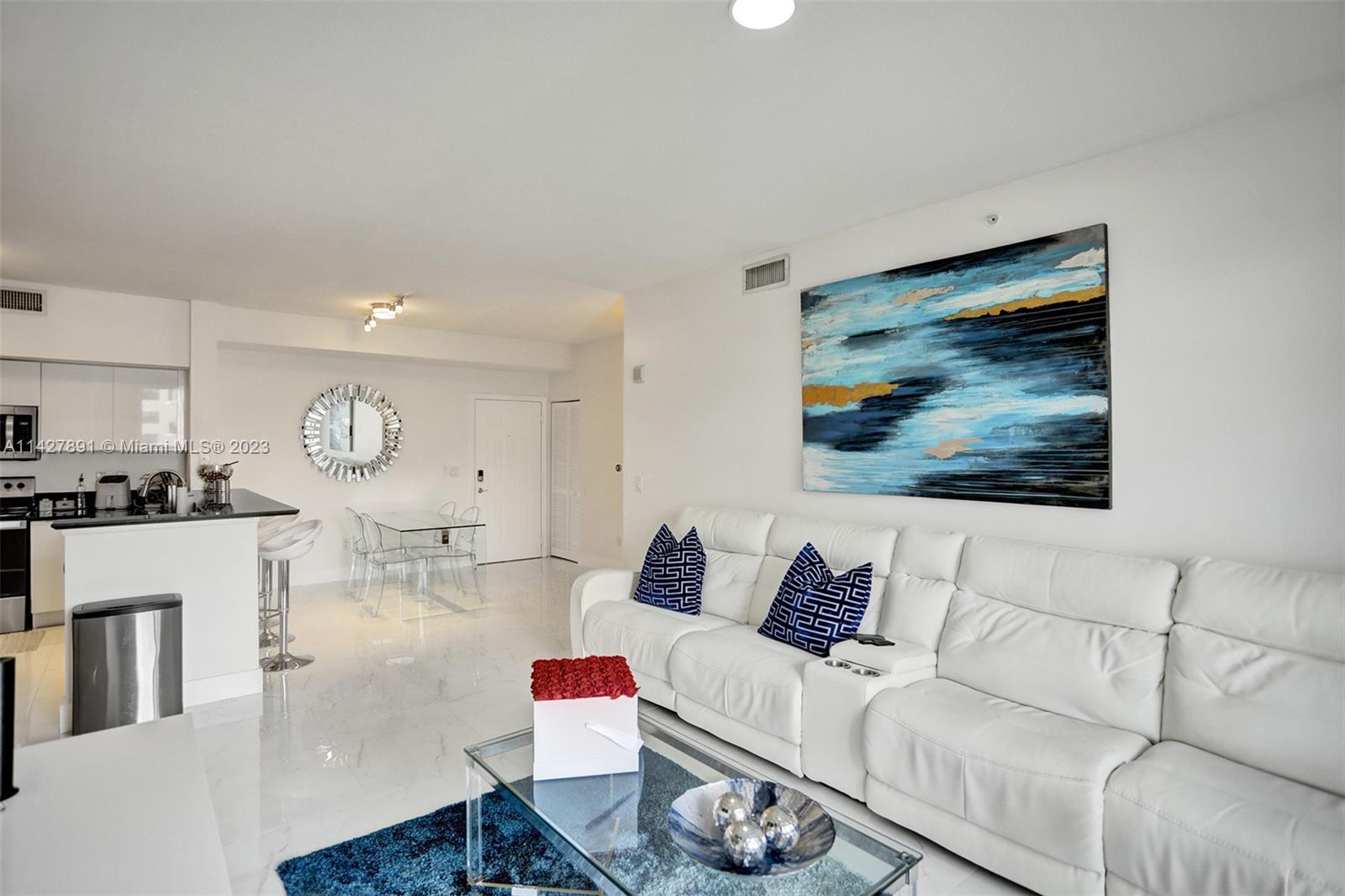 233 South Federal Highway, Unit 605 Boca Raton, FL 33432 - Photo 34 of 41 a living room with furniture a rug and wall painting