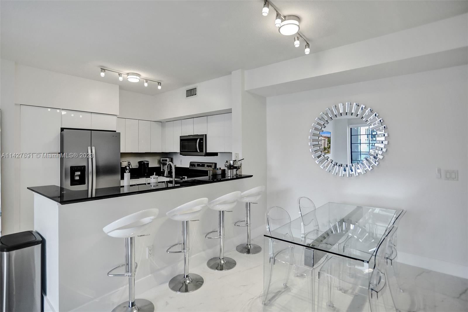 233 South Federal Highway, Unit 605 Boca Raton, FL 33432 - Photo 6 of 41 a kitchen with stainless steel appliances a refrigerator sink and microwave