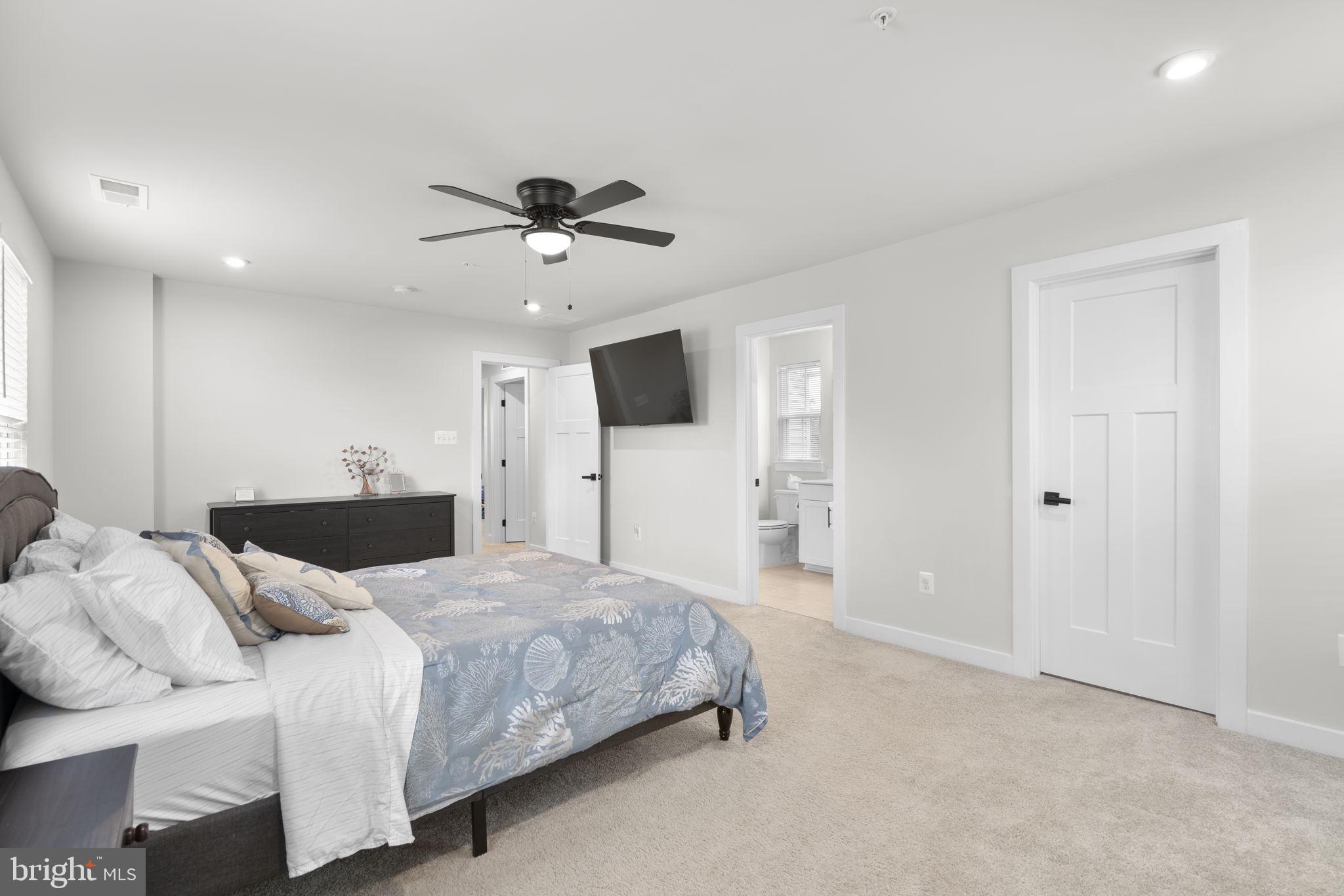 1713 Aurora Way Frederick, MD 21702 - Photo 31 of 57 a living room with a bed furniture and a flat screen tv