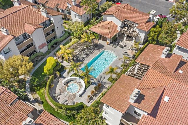 an aerial view of a house with a swimming pool
