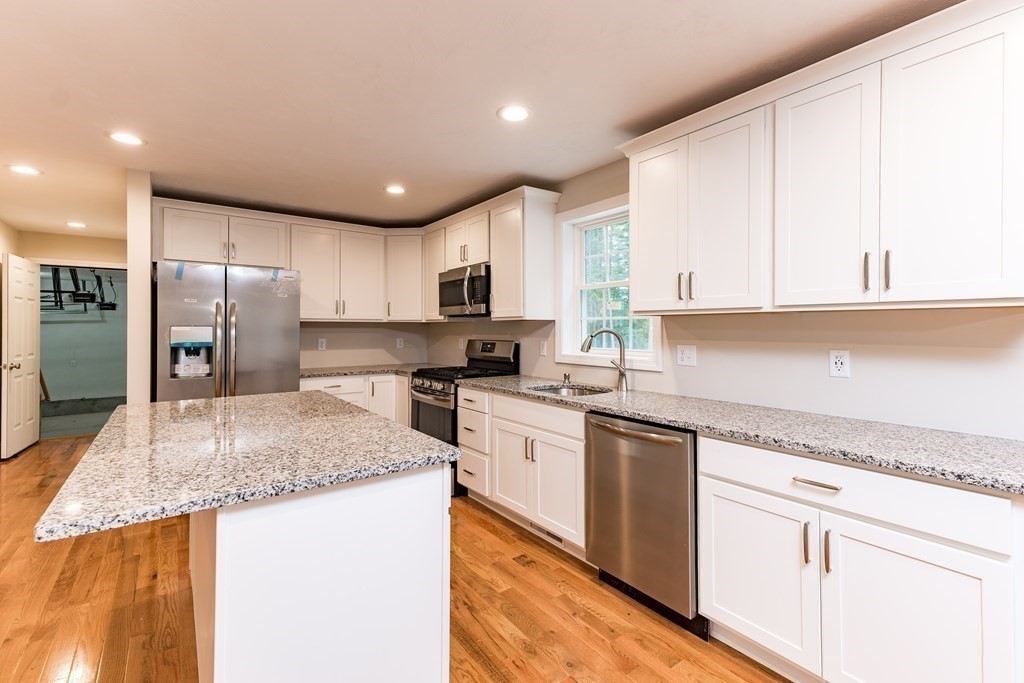 10 Squirrel Island Road West Wareham, MA 02576 - Photo 3 of 12 a kitchen with stainless steel appliances granite countertop a sink refrigerator and cabinets