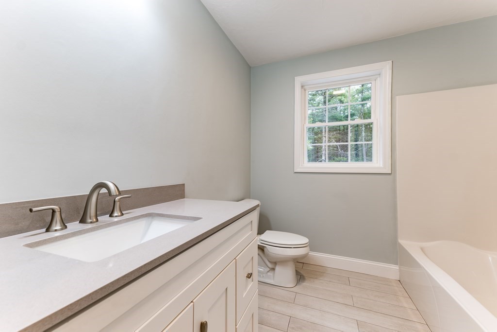10 Squirrel Island Road West Wareham, MA 02576 - Photo 8 of 12 a bathroom with a sink toilet and bathtub