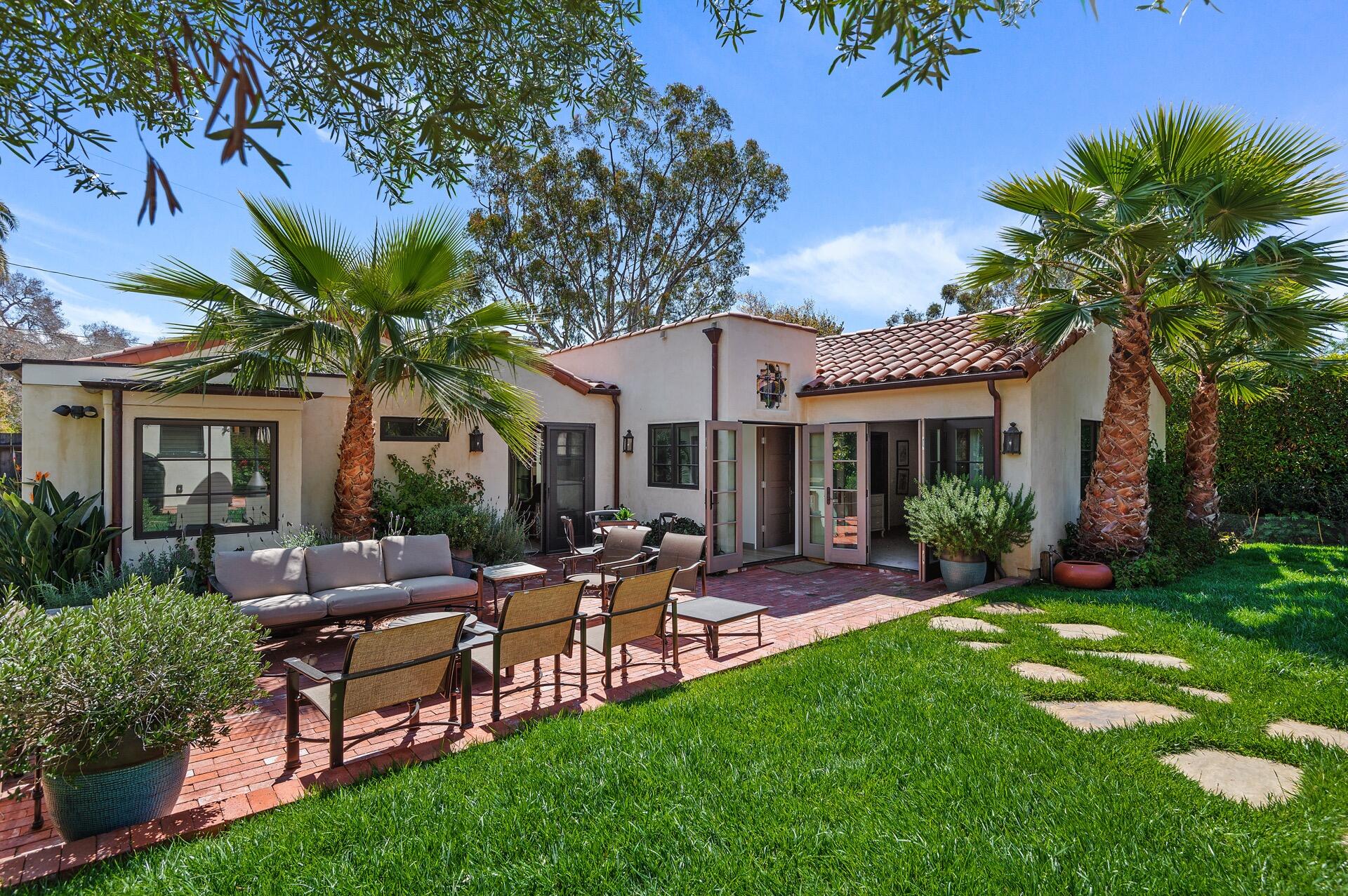 Undisclosed Address Montecito, CA 93108 - Photo 13 of 33 a view of a house with a backyard and a patio