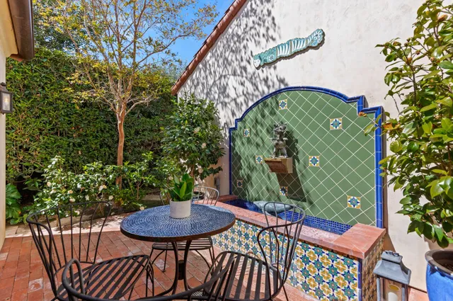 a view of a chairs and table in the balcony