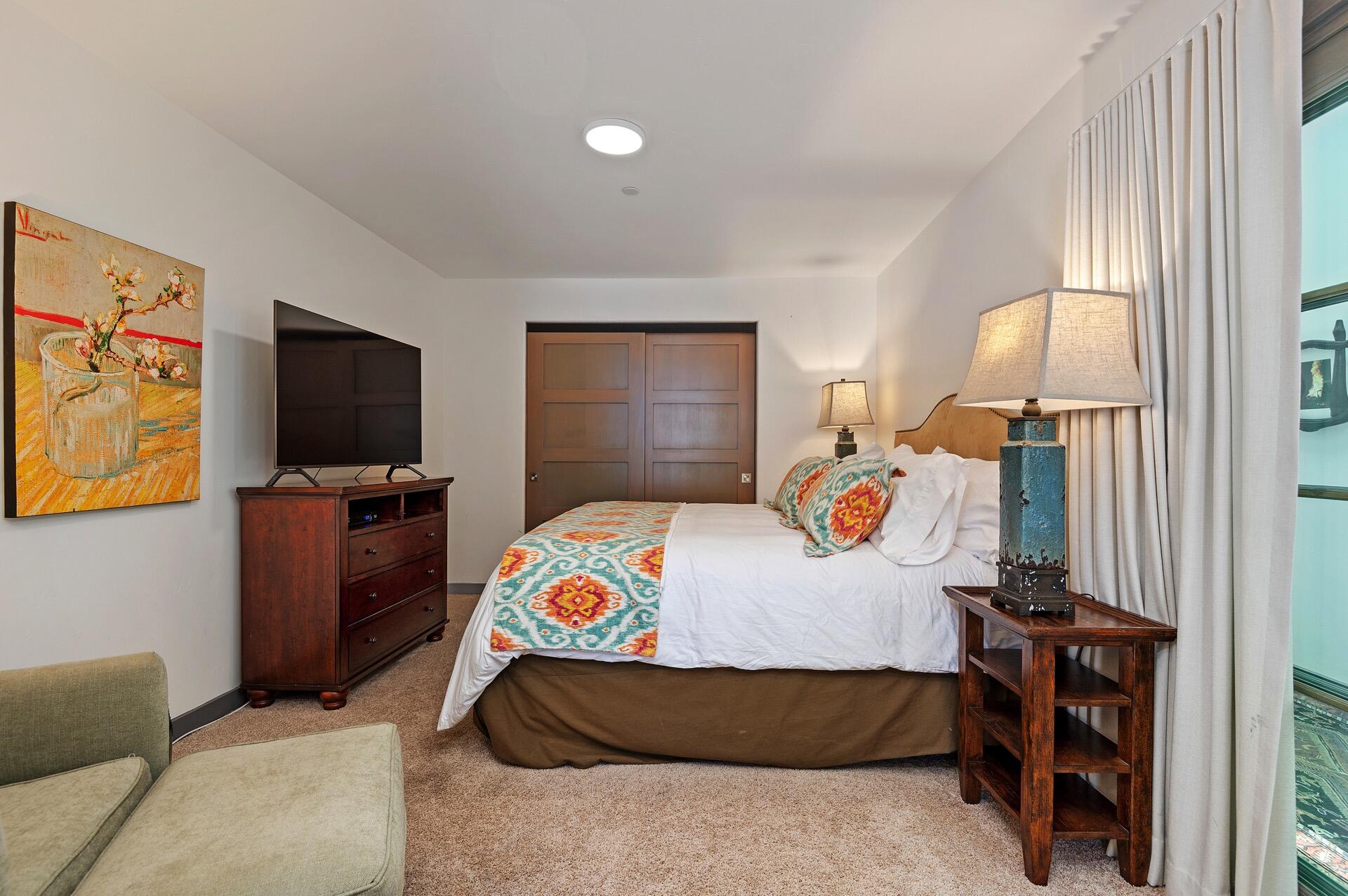 Undisclosed Address Montecito, CA 93108 - Photo 18 of 33 a bedroom with a bed and a flat tv screen on dresser