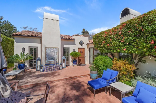 a view of a chair and tables in the patio