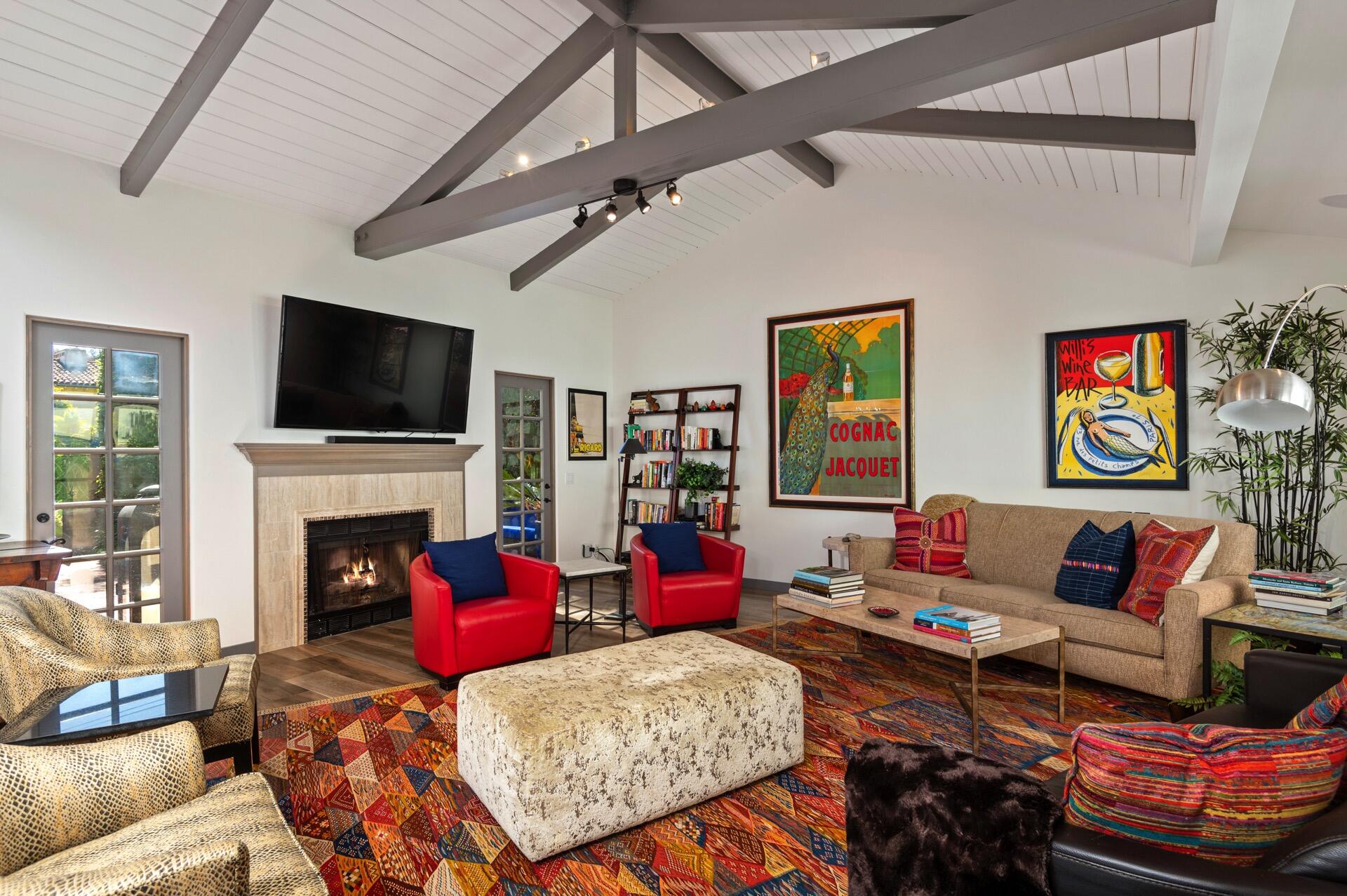 Undisclosed Address Montecito, CA 93108 - Photo 4 of 33 a living room with furniture a flat screen tv and a fireplace