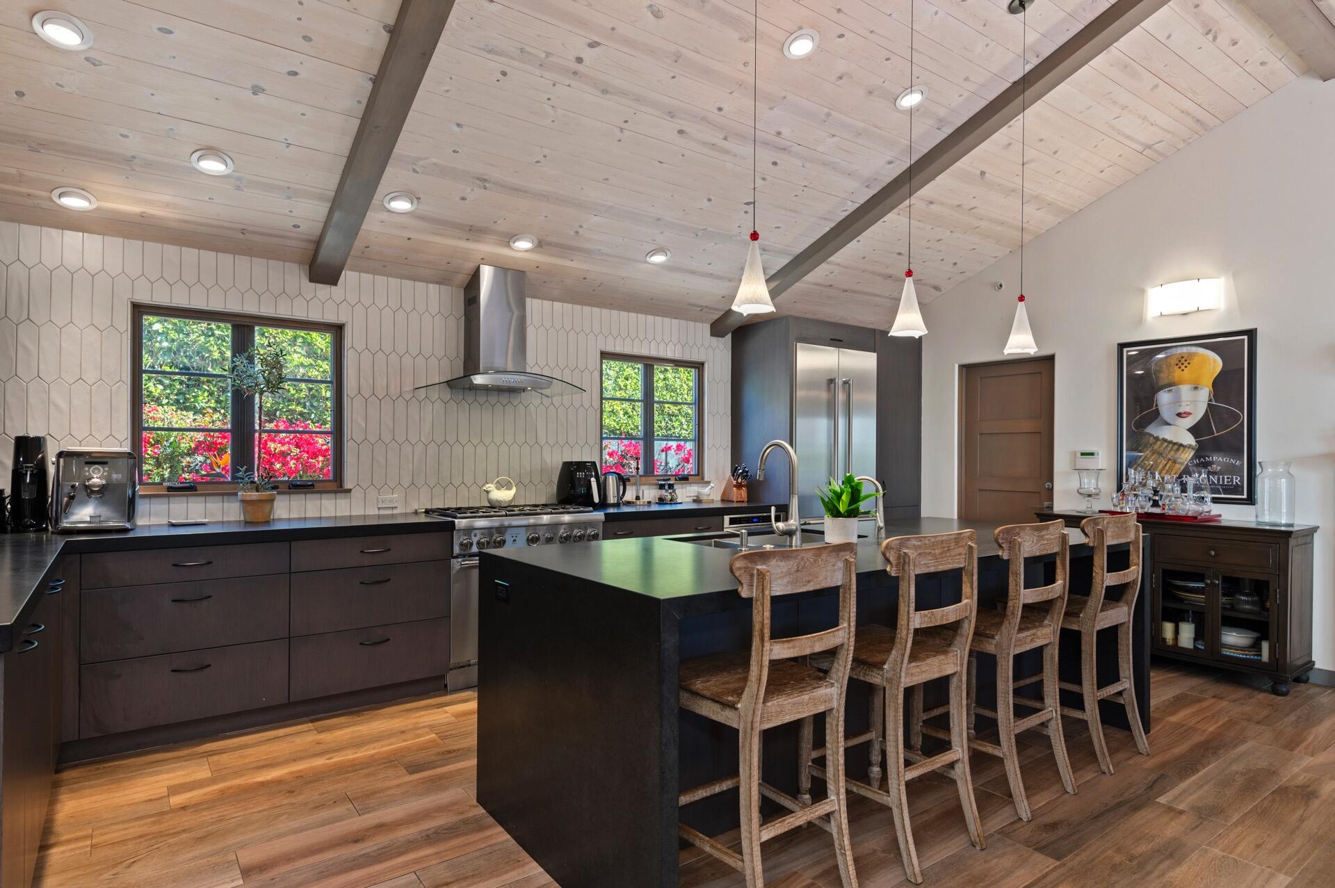Undisclosed Address Montecito, CA 93108 - Photo 10 of 33 a large kitchen with lots of counter space and dining table