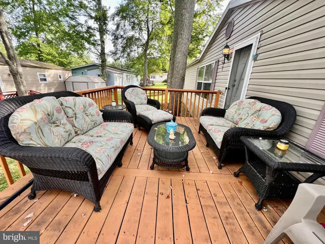 a view of balcony with deck and outdoor seating