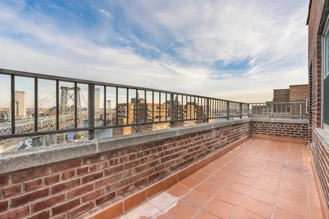 a balcony with furniture and city view