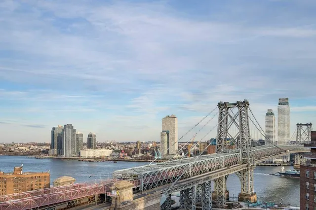 a view of a balcony with trees