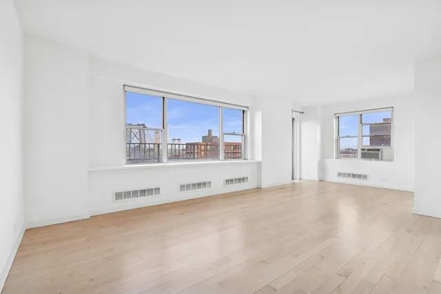 a view of a city with tall buildings