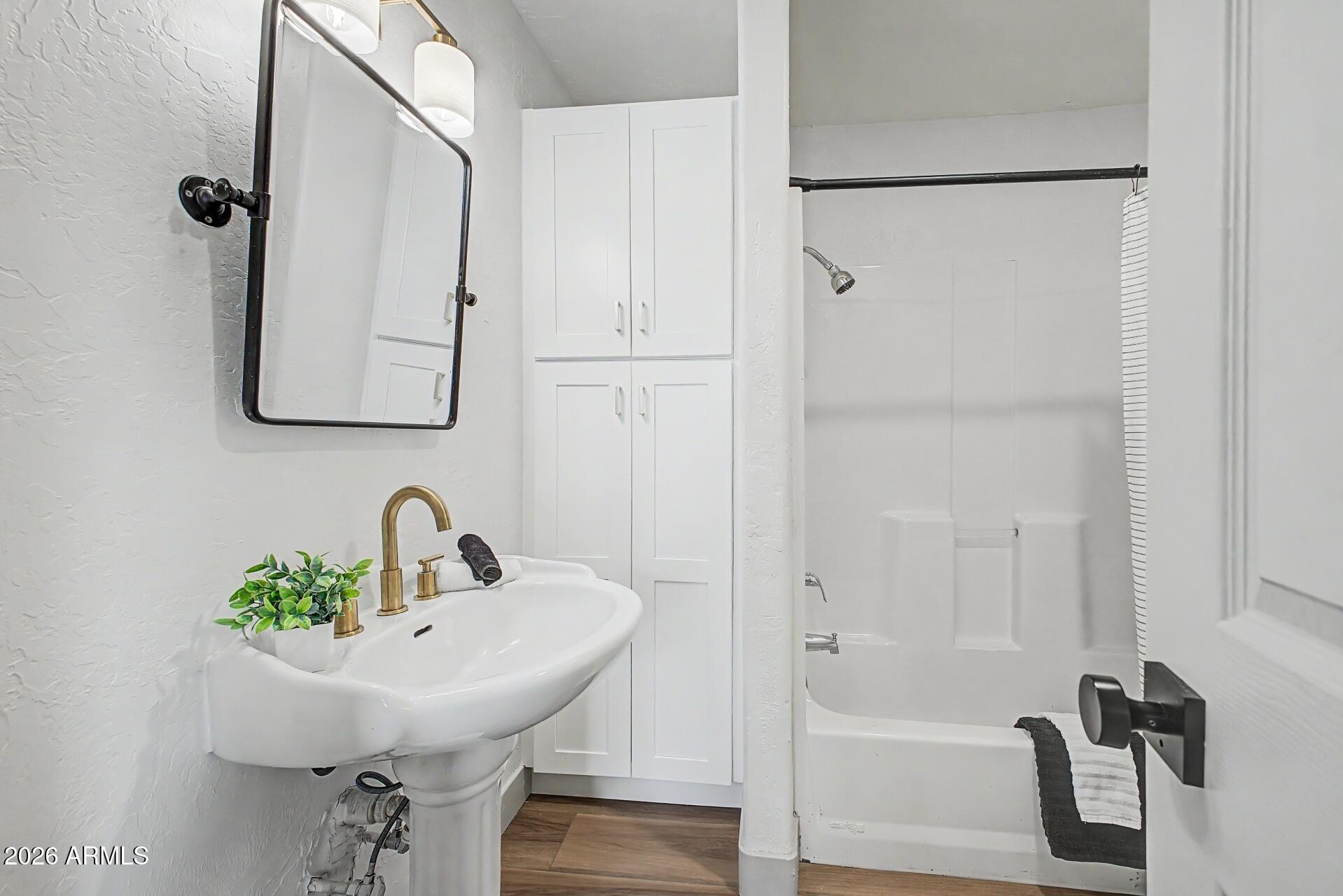 1914 East Monte Vista Road Phoenix, AZ 85006 - Photo 21 of 26 a bathroom with a sink and a mirror