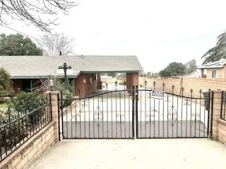 a view of a house with a iron gate