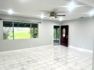 a view of an empty room with a window