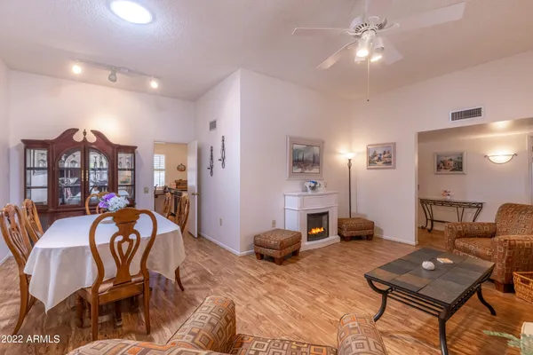 a workspace with furniture and chandelier