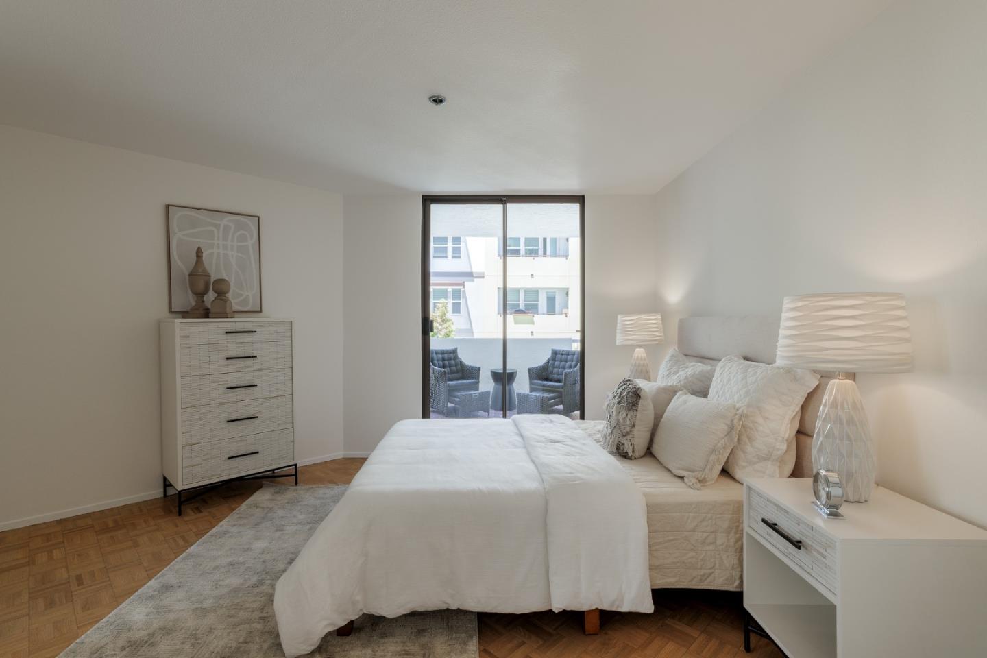 110 Park Road, Unit 202 Burlingame, CA 94010 - Photo 11 of 31 a bedroom with a bed and a window