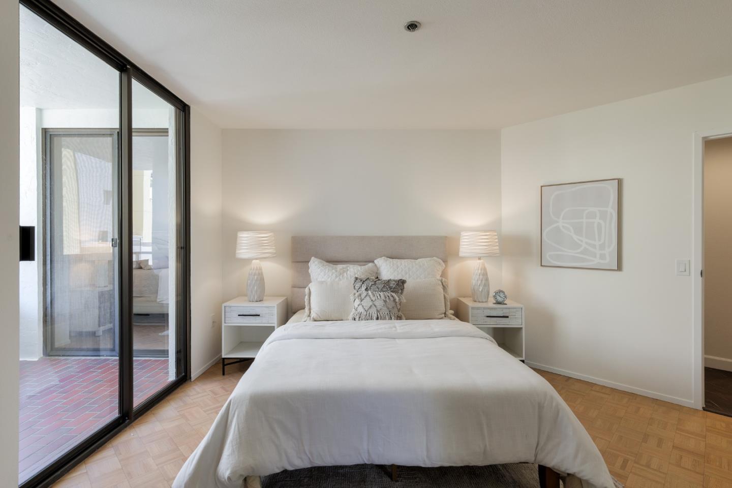 110 Park Road, Unit 202 Burlingame, CA 94010 - Photo 12 of 31 a bedroom with a bed and a night stand