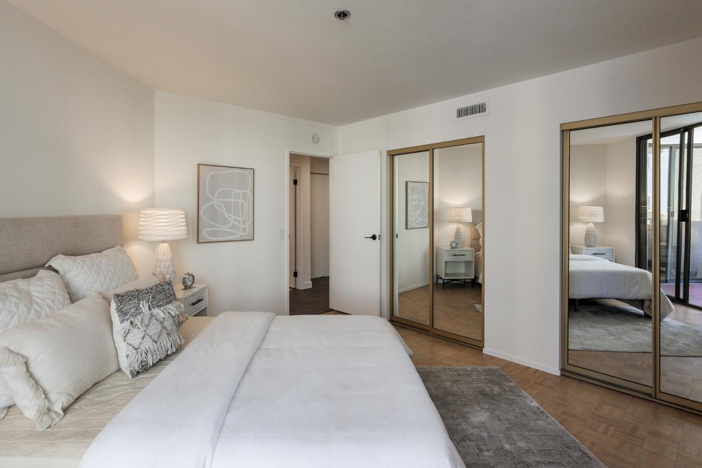 110 Park Road, Unit 202 Burlingame, CA 94010 - Photo 13 of 31 a bedroom with furniture and a walk in closet