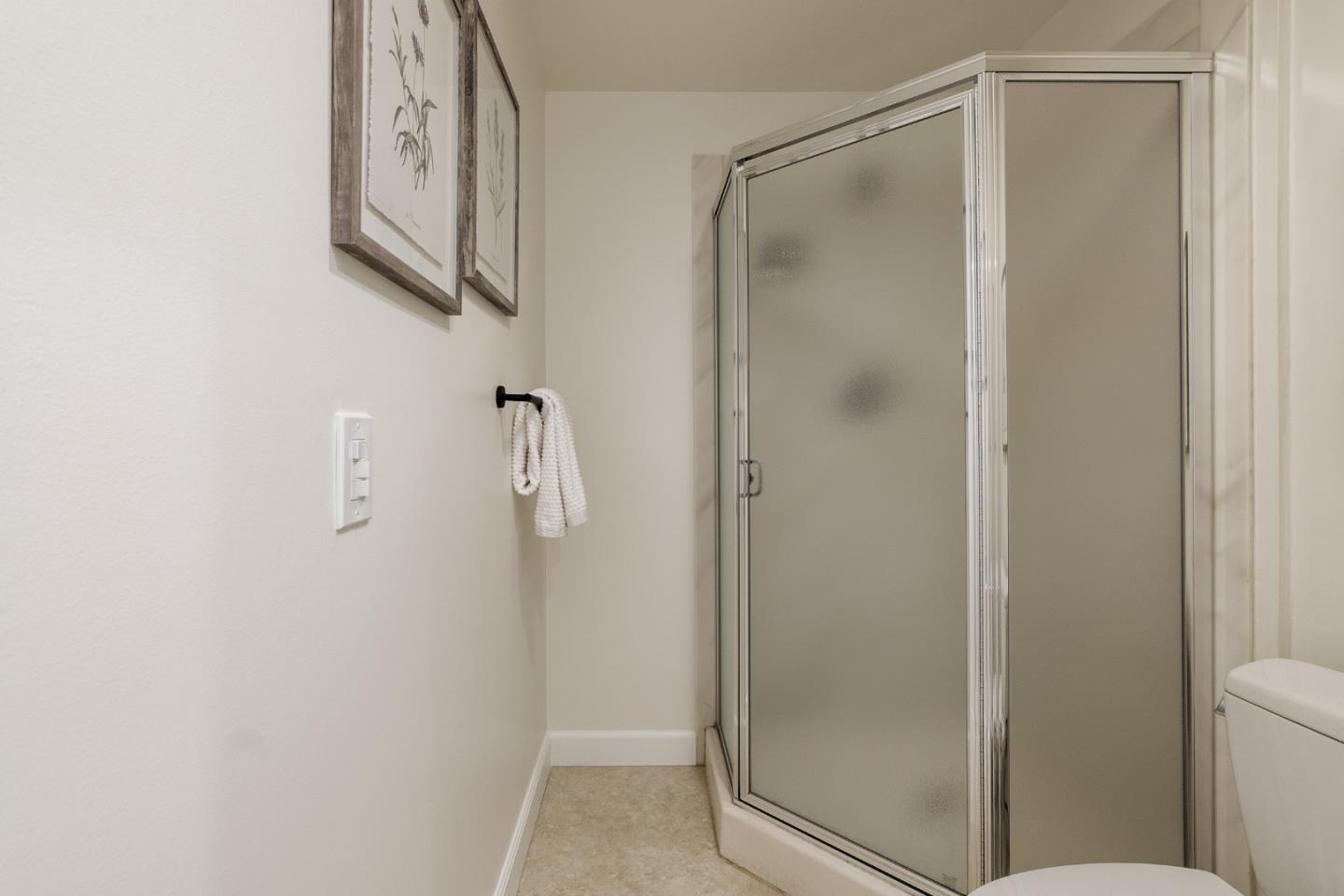 110 Park Road, Unit 202 Burlingame, CA 94010 - Photo 15 of 31 a bathroom with a glass shower door