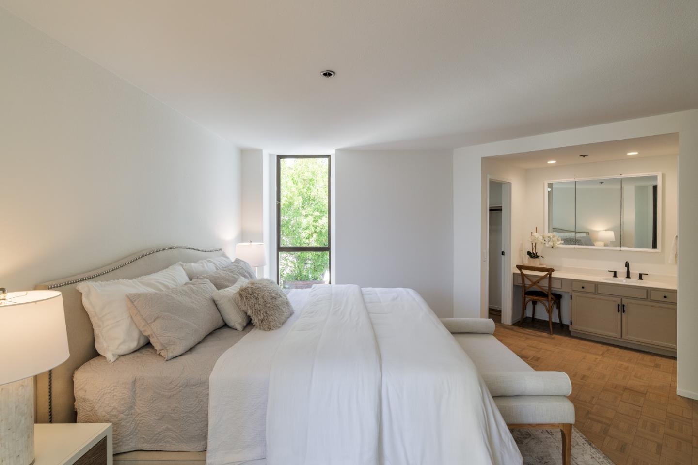 110 Park Road, Unit 202 Burlingame, CA 94010 - Photo 18 of 31 a bedroom with a large bed and a window