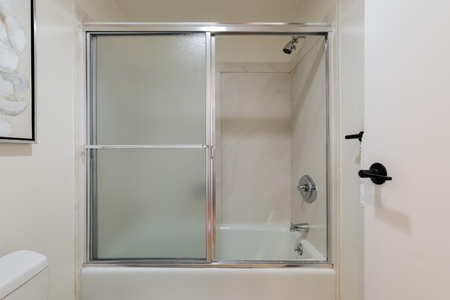 110 Park Road, Unit 202 Burlingame, CA 94010 - Photo 20 of 31 a bathroom with a shower and a toilet