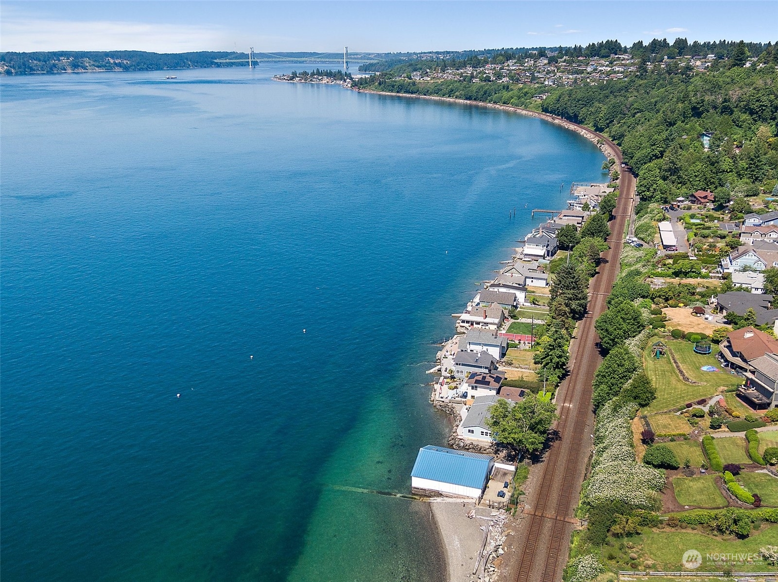4436 Sunset Beach Road West University Place, WA 98466 - Photo 33 of 33 a view of a lake from a balcony